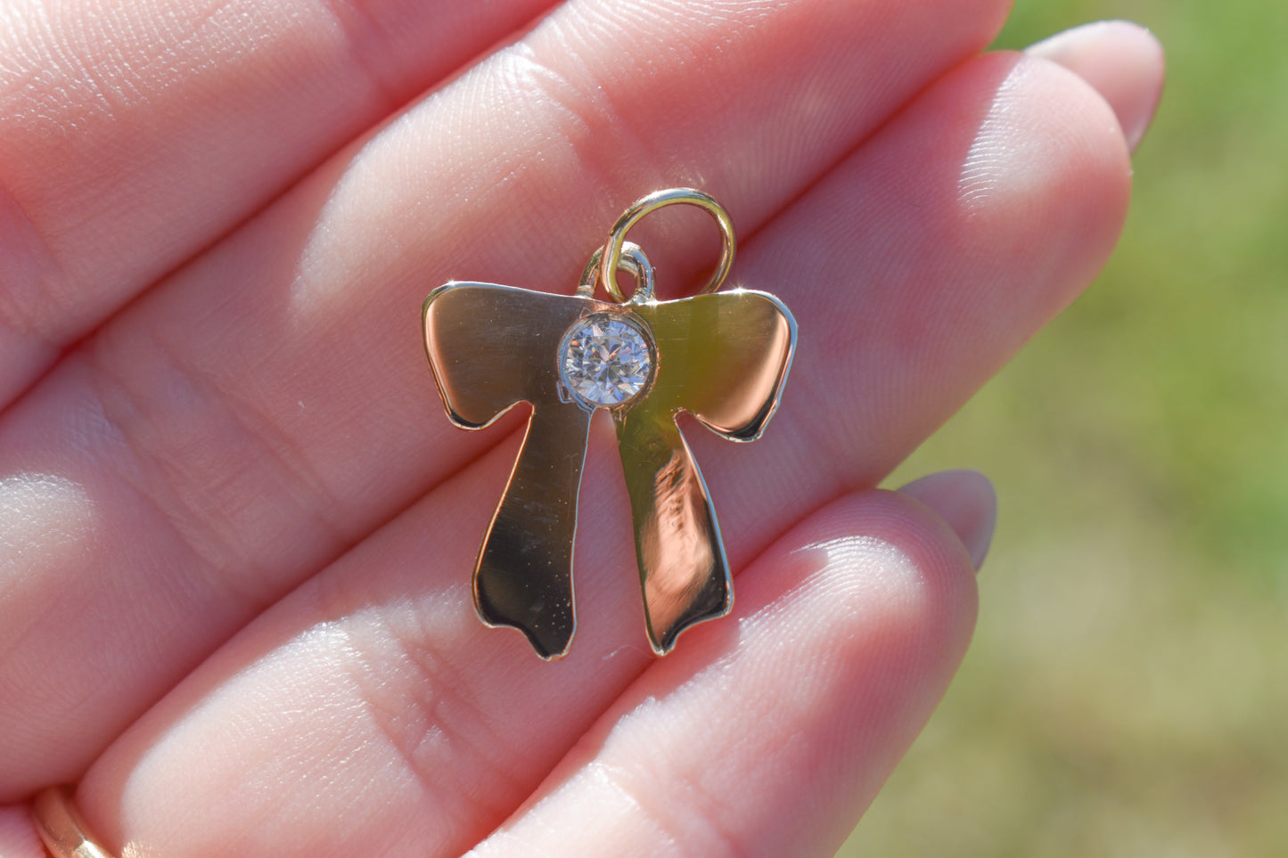 Handmade 14k Yellow Gold Bow Pendant with CZ