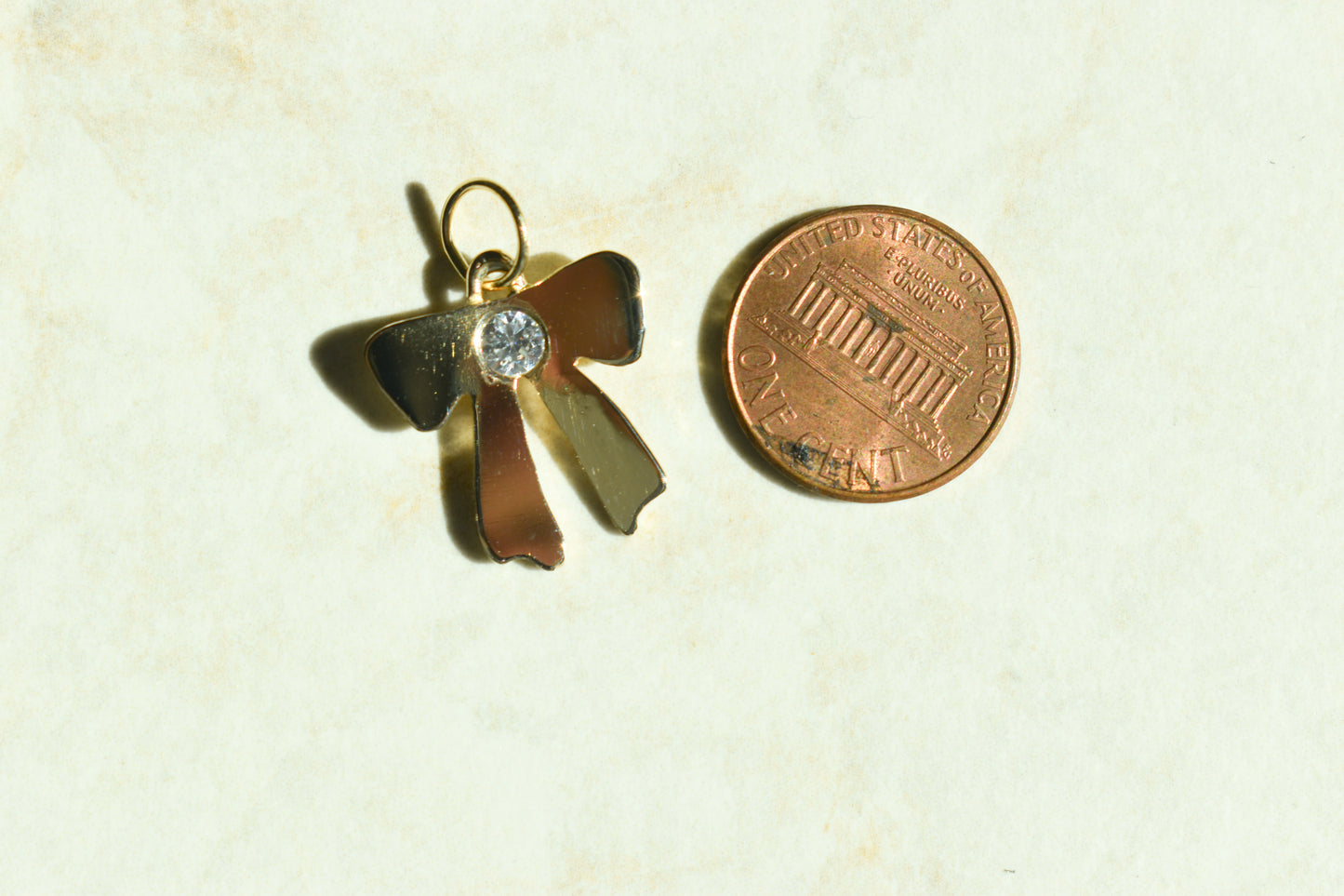 Handmade 14k Yellow Gold Bow Pendant with CZ